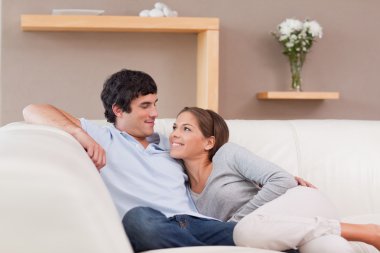 Couple on the sofa in love clipart