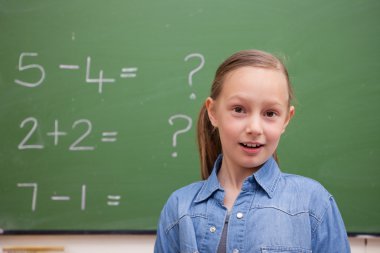 Smiling schoolgirl posing clipart