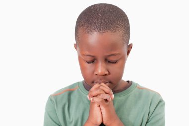 Young boy praying clipart