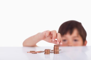 Boy counting his change clipart