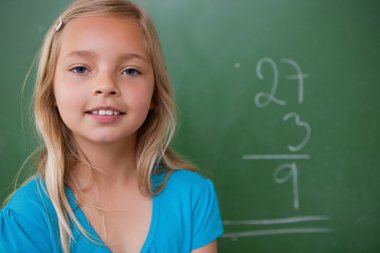 Little schoolgirl posing clipart