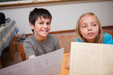 Pupils receiving their school report clipart