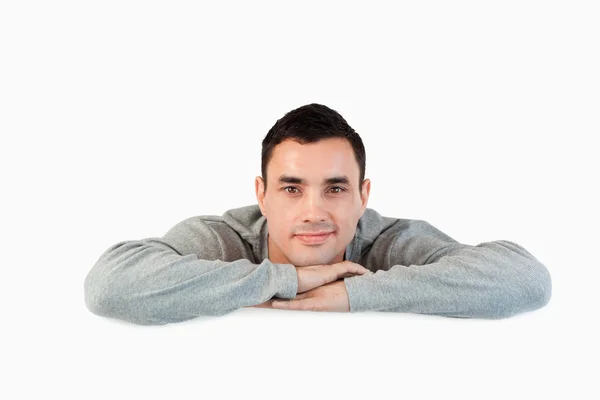 Young male looking over a wall — Stock Photo, Image