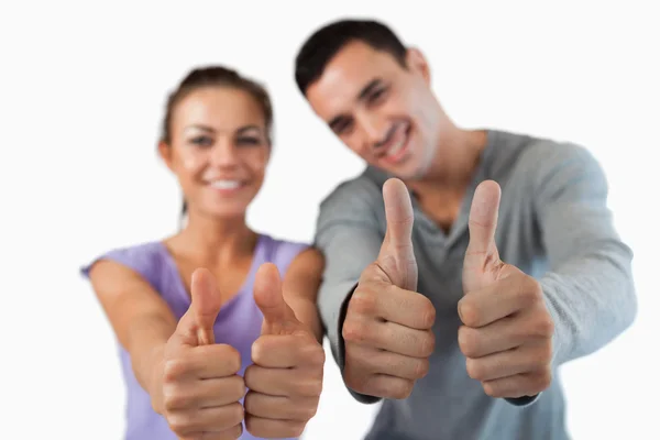 Approval being given by young couple — Stock Photo, Image