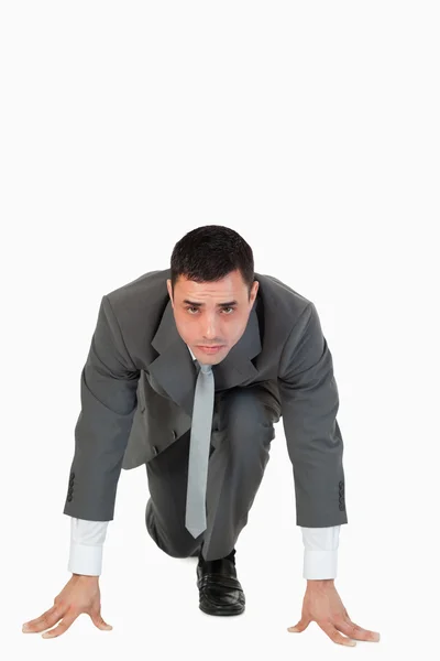 Portrait of a businessman in the starting blocs — Stock Photo, Image