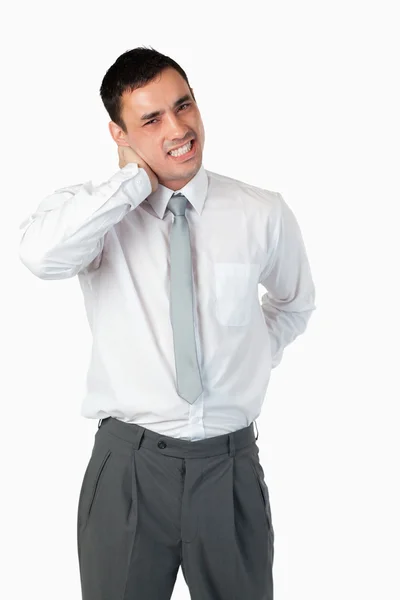 Portrait of a young businessman having a back pain — Stock Photo, Image