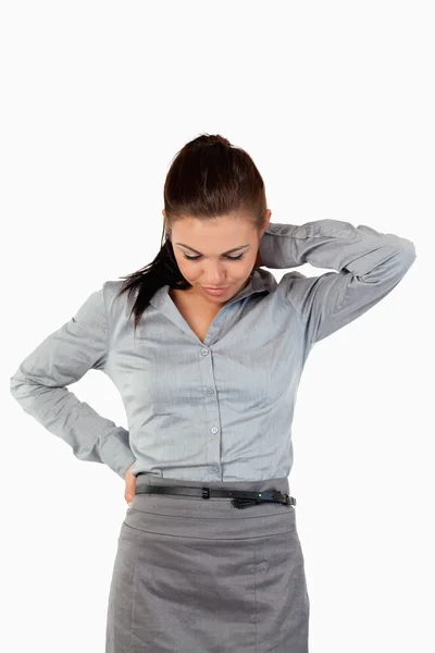 Retrato de uma mulher de negócios triste com dor nas costas — Fotografia de Stock