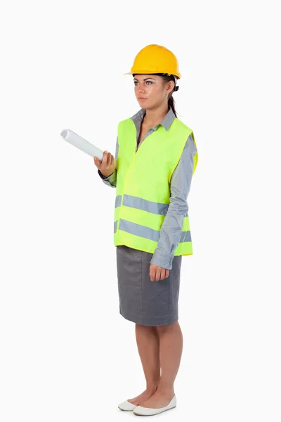 Portrait of a serious female architect with a plan — Stock Photo, Image