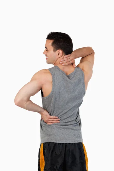 Portrait of a sports man having a back pain — Stock Photo, Image