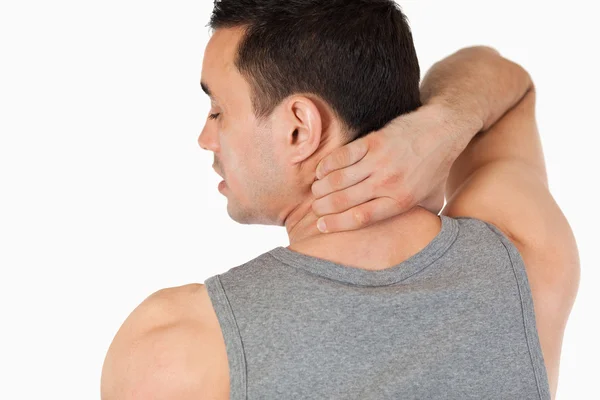 Young man having a back pain — Stock Photo, Image