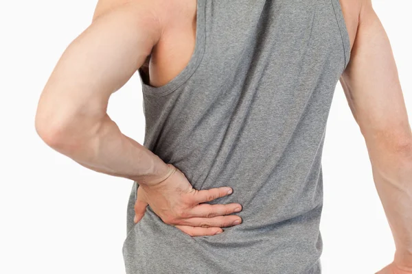 Mani maschili toccare la propria colonna vertebrale — Foto Stock