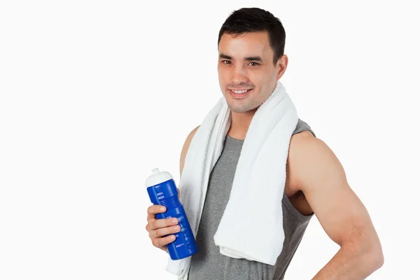 Young male with a bottle after workout — Stock Photo, Image