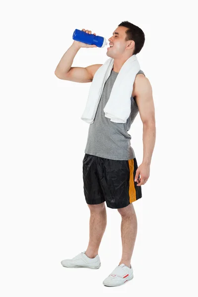 Young male drinking after workout — Stock Photo, Image