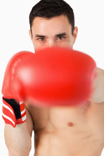 Boxer striking with his left — Stock Photo, Image