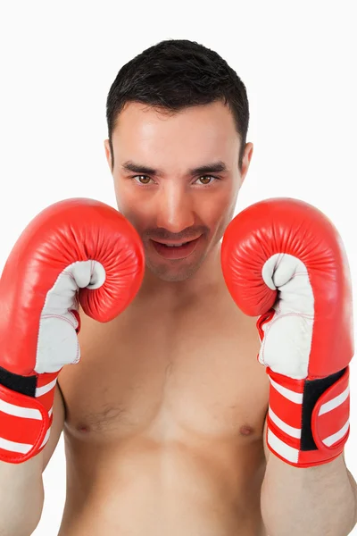 Confident looking boxer behind cover — Stock Photo, Image