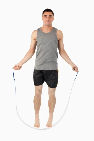 Young sportsman doing jump roping — Stock Photo, Image