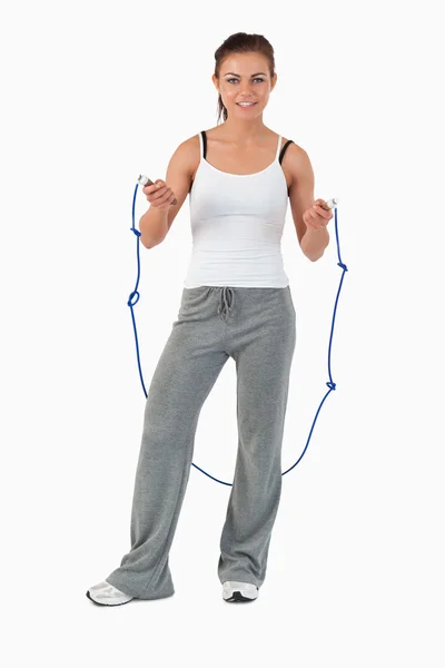Young woman about to start jump roping — Stock Photo, Image