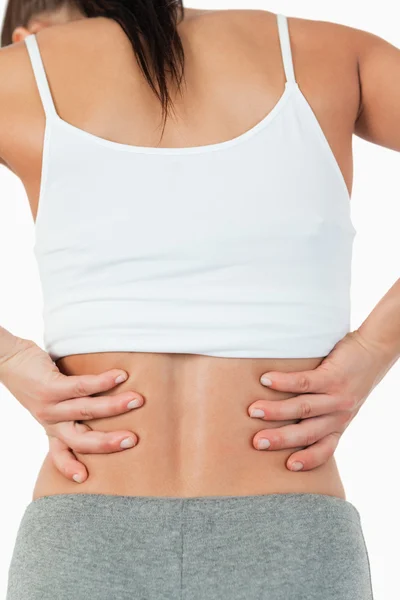Visão traseira da fêmea com dor nas costas — Fotografia de Stock