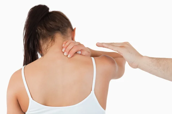 stock image Back view of female having pain in her neck