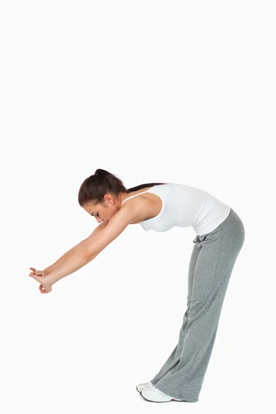 Young woman doing her stretches — Stock Photo, Image