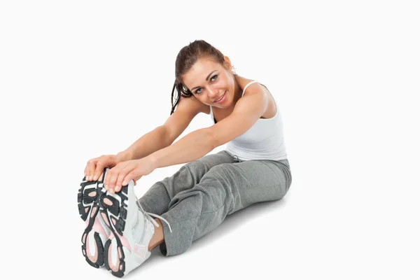 Young woman stretching before training — Stock Photo, Image
