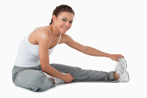 Side view of stretching woman — Stock Photo, Image