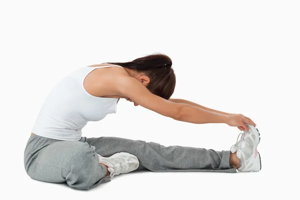 Side view of woman stretching — Stock Photo, Image