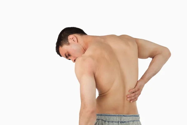 Погляд на людину, яка страждає від болю в спині — стокове фото