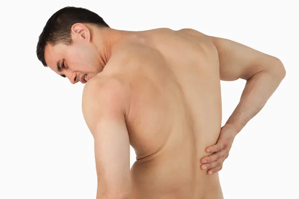 Visão traseira do sexo masculino que sofre de dor nas costas — Fotografia de Stock
