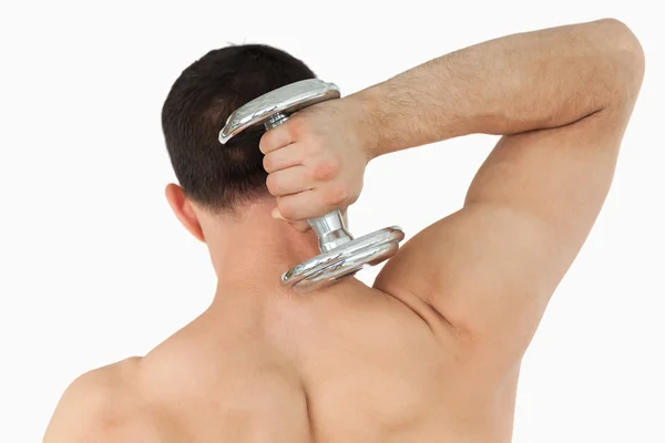 Back view of male lifting weight — Stock Photo, Image