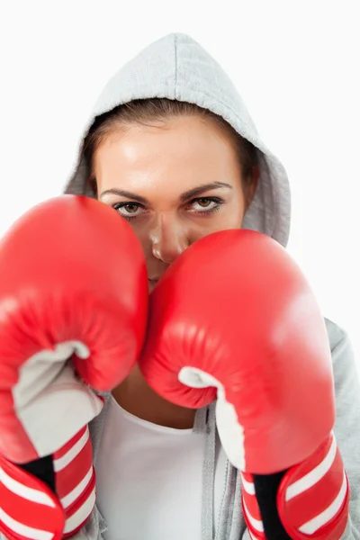 Female boxer with hoodie on in defensive stance — Stock Photo, Image