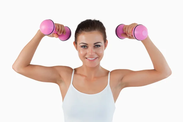Sports woman working out with dumbbells — Stock Photo, Image