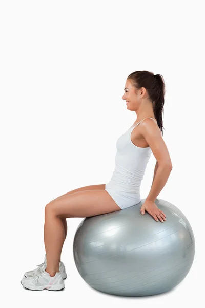 Portrait of a joyful woman working out with a ball — Stock Photo, Image