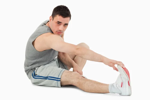Sports man stretching up — Stock Photo, Image