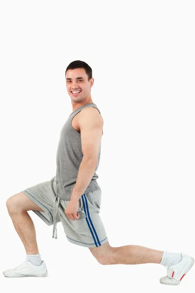 Portrait of a man stretching his legs — Stock Photo, Image