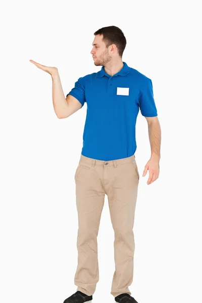 Young salesman presenting in his palm — Stock Photo, Image