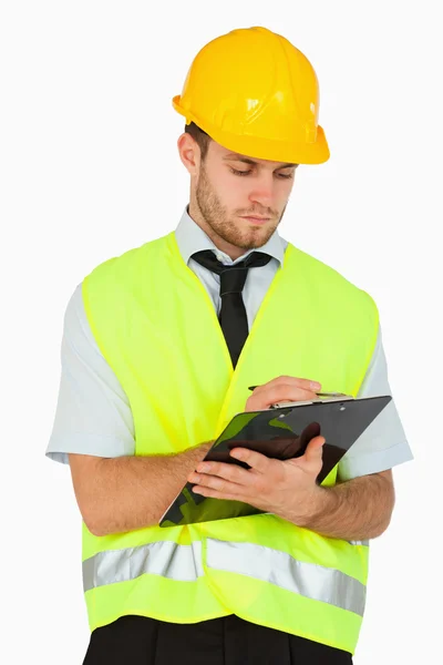 Young foreman taking notes — Stock Photo, Image