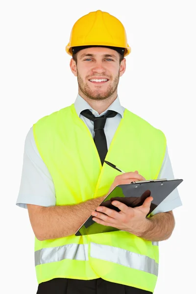Smiling young foreman with his clipboard — Stock Photo, Image