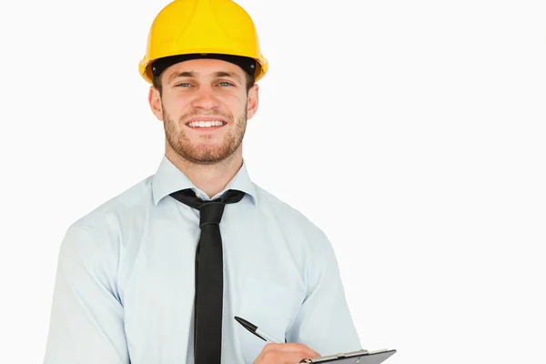 Smiling young lead worker with his clipboard — Stock Photo, Image