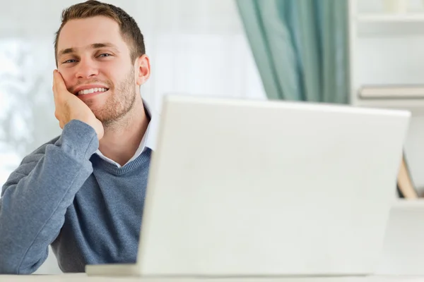 Businessman smiling tired in his homeoffice — Stock Photo, Image