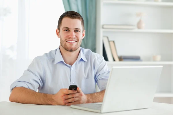 stock image Young businessman typing text message in his homeoffice