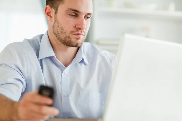 stock image Businessman with cellphone and notebook