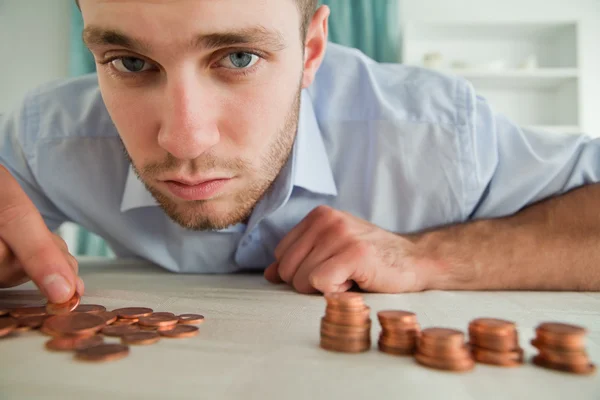 Businessman counting his change — Stock Photo, Image