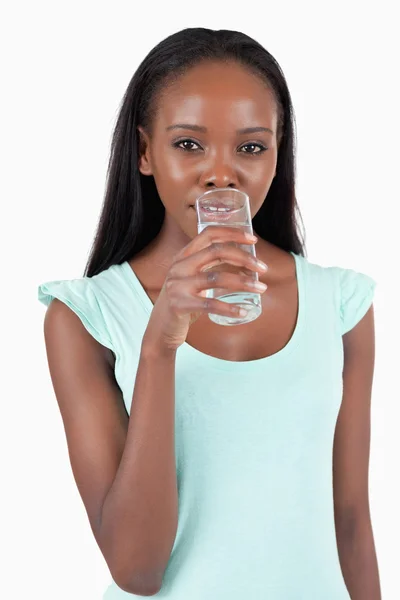 Young woman taking a sip of refreshing water — Stock Photo, Image