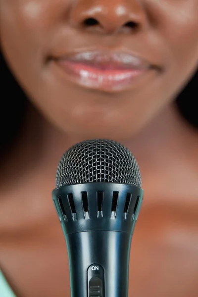 Close up of microphone being used by singer — Stock Photo, Image