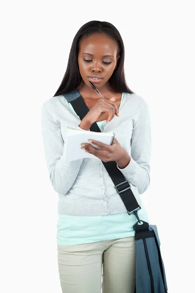 Young student working on her notes — Stock Photo, Image