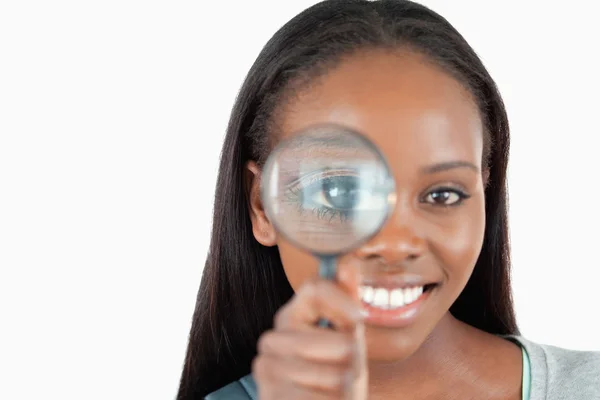 Smiling woman with magnifier — Stock Photo, Image