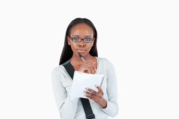 Young woman with glasses and notepad — Stock Photo, Image