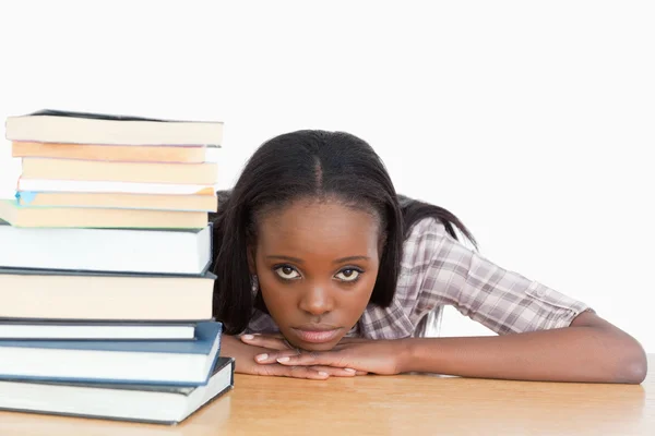 Bored student leaning on her hands — Stock Photo, Image