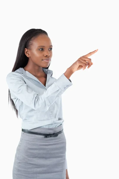 Portrait of a young businesswoman pressing an invisible key — Stock Photo, Image